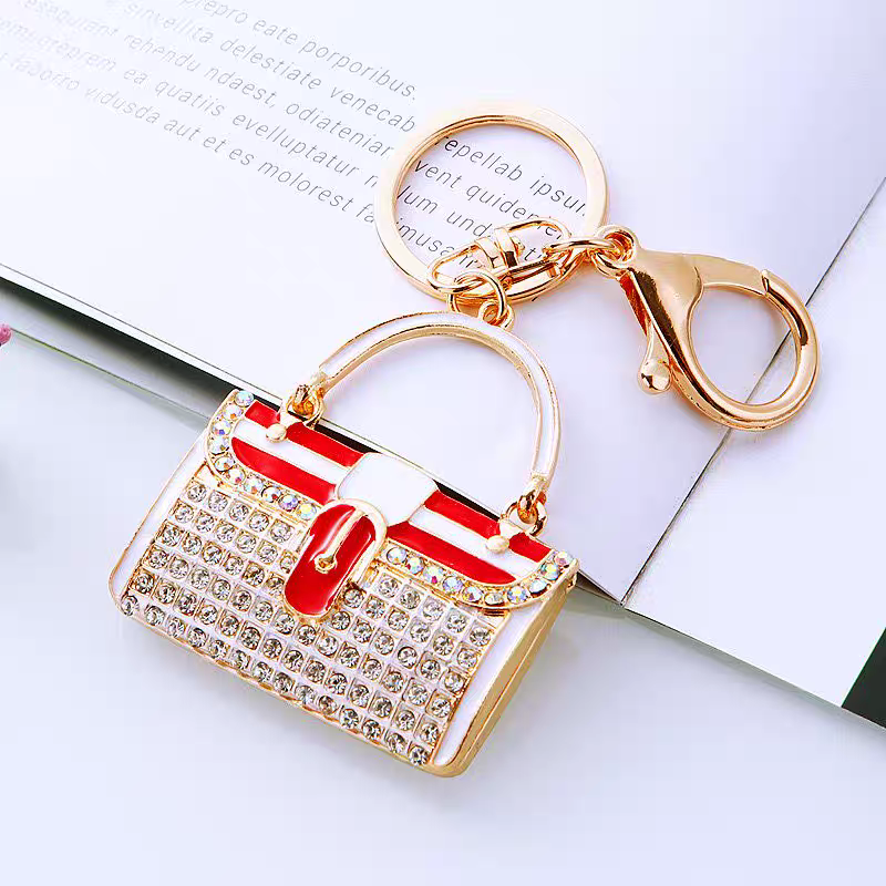 Diamond-encrusted striped small shoulder bag shaped car keychain, cute metal bag pendant keychain, creative and fashionable motorcycle keychain detail image 2