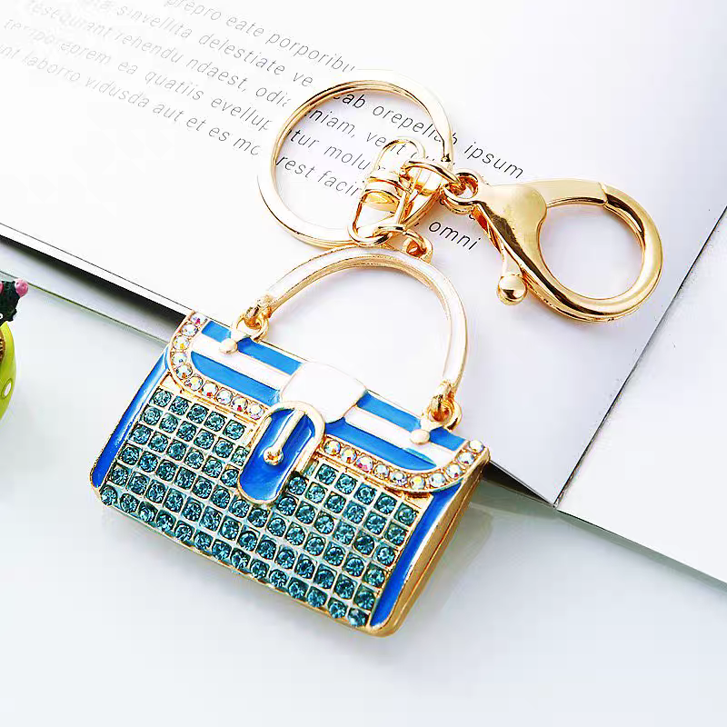 Diamond-encrusted striped small shoulder bag shaped car keychain, cute metal bag pendant keychain, creative and fashionable motorcycle keychain Specification image