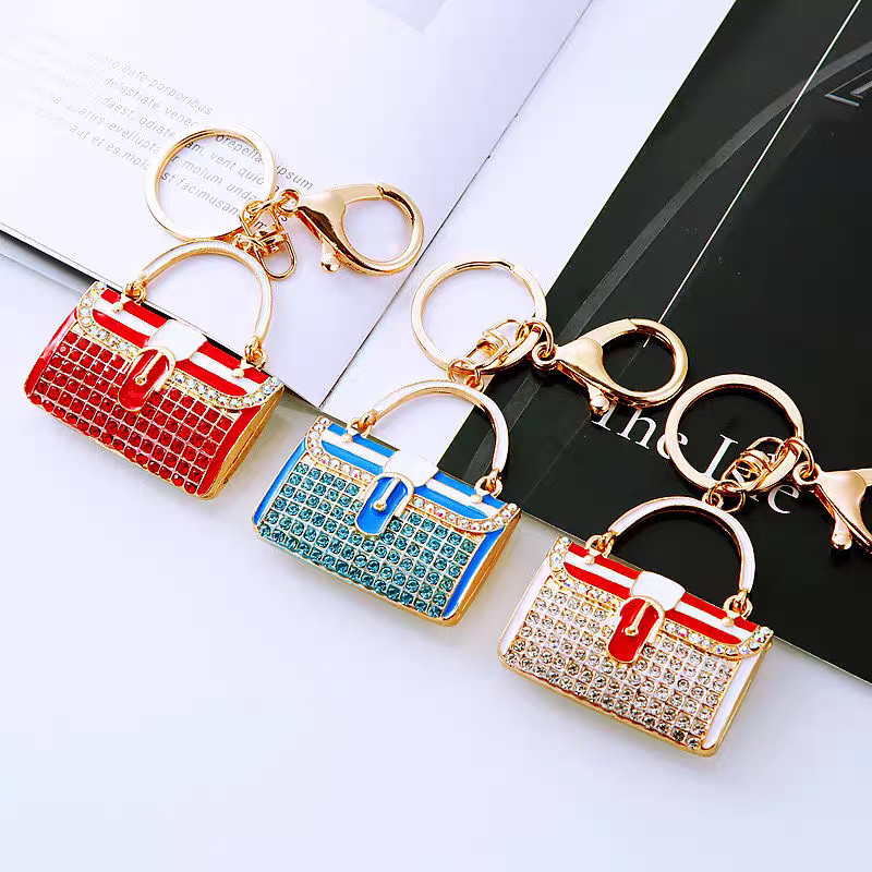 Diamond-encrusted striped small shoulder bag shaped car keychain, cute metal bag pendant keychain, creative and fashionable motorcycle keychain detail image 5