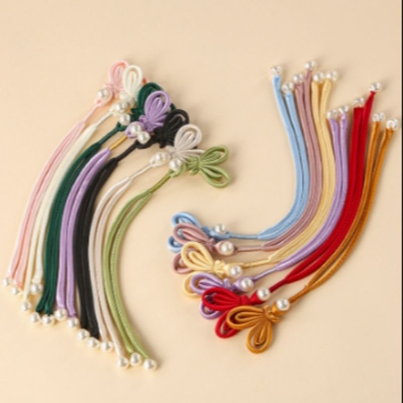 The new Chinese-style hand-wound butterfly tassel button of the traditional Chinese fashion cheongsam with a high-end feel