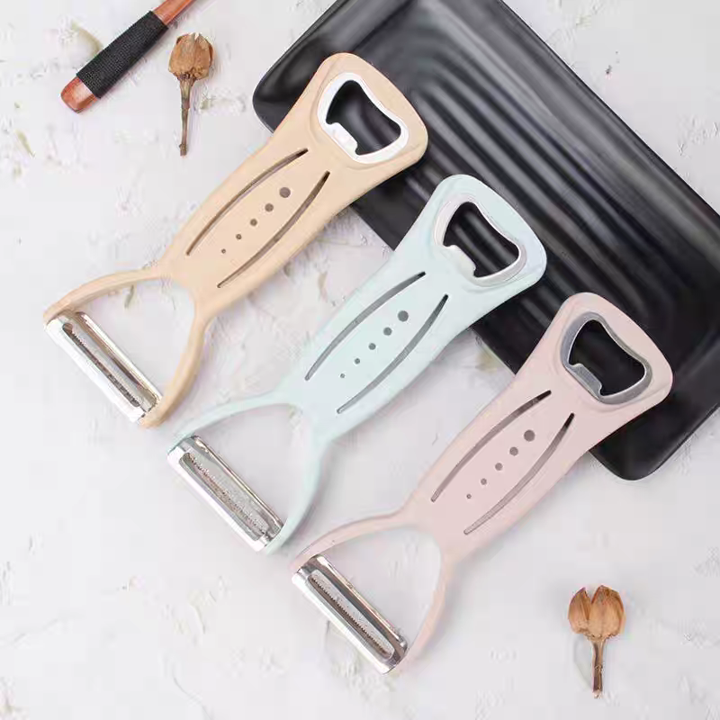 A multi-functional kitchen peeler, shred and bottle opening wonder. A three-in-one peeler and shred wonder detail image 2