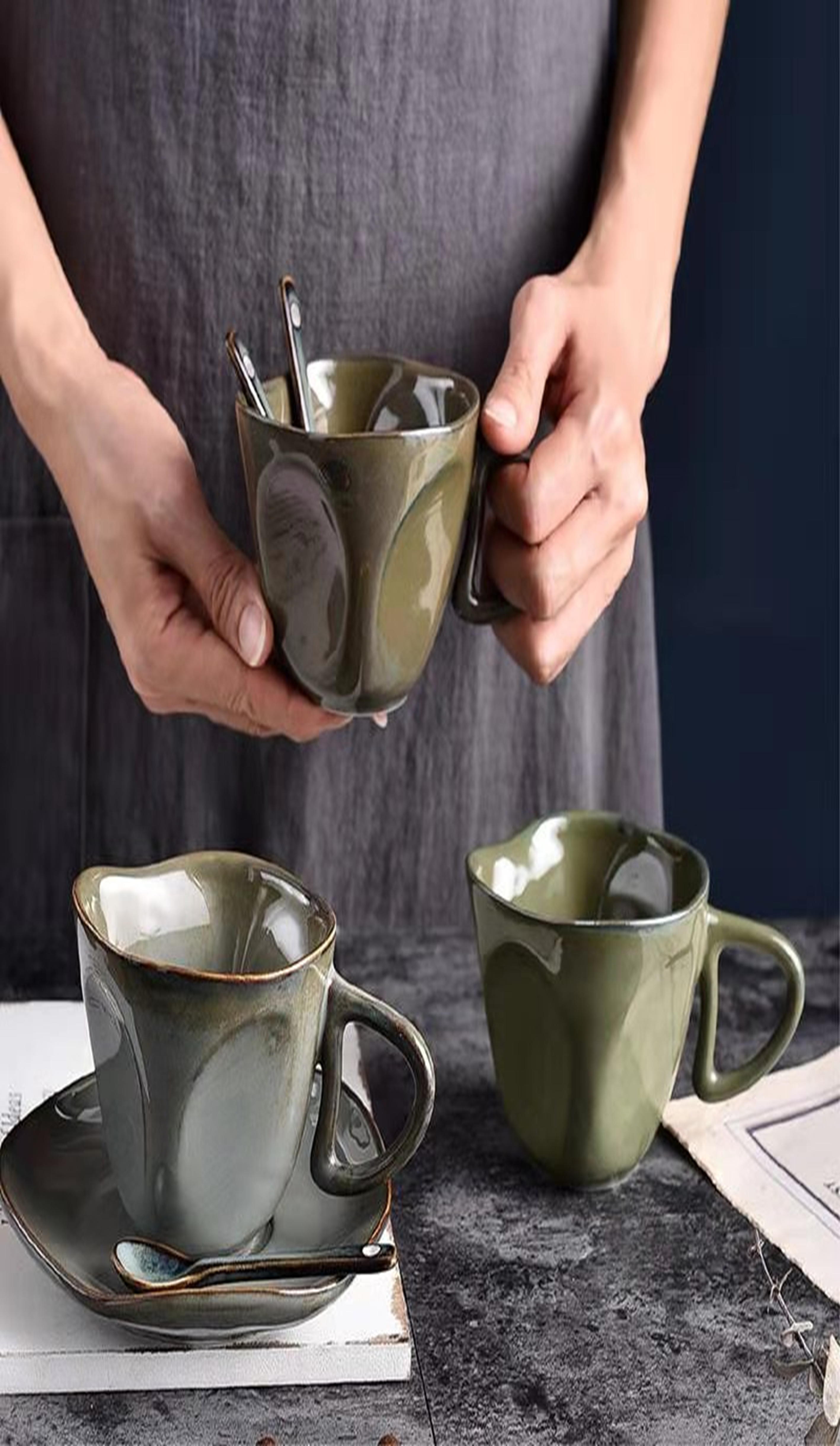 Irregular-shaped cups and plates are available in cement gray, sand brown, bronze, fish-belly white and lake green TTB-048