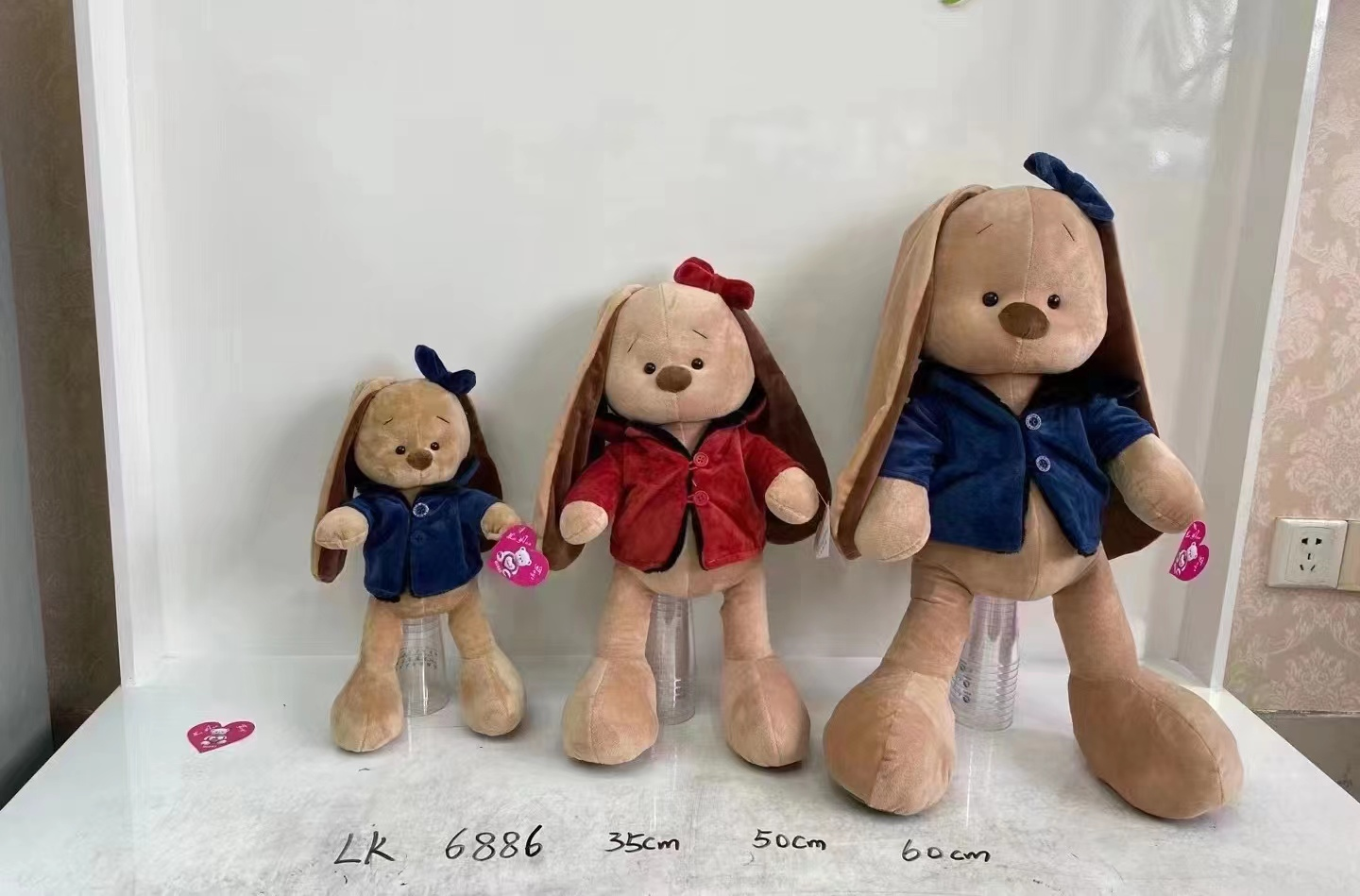 This is a high-quality plush toy doll with a stylish appearance that children all love. It's a windbreaker rabbit details Picture