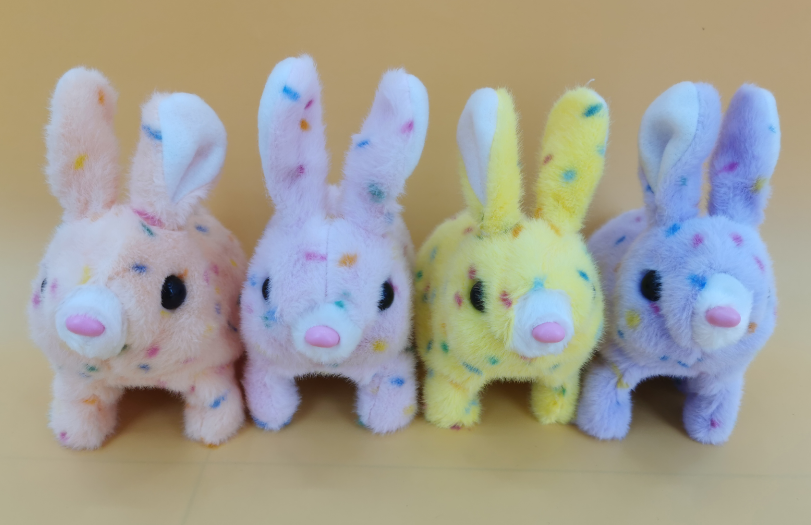 The electric plush colorful spotted little rabbit will be cute and playful, singing along with others