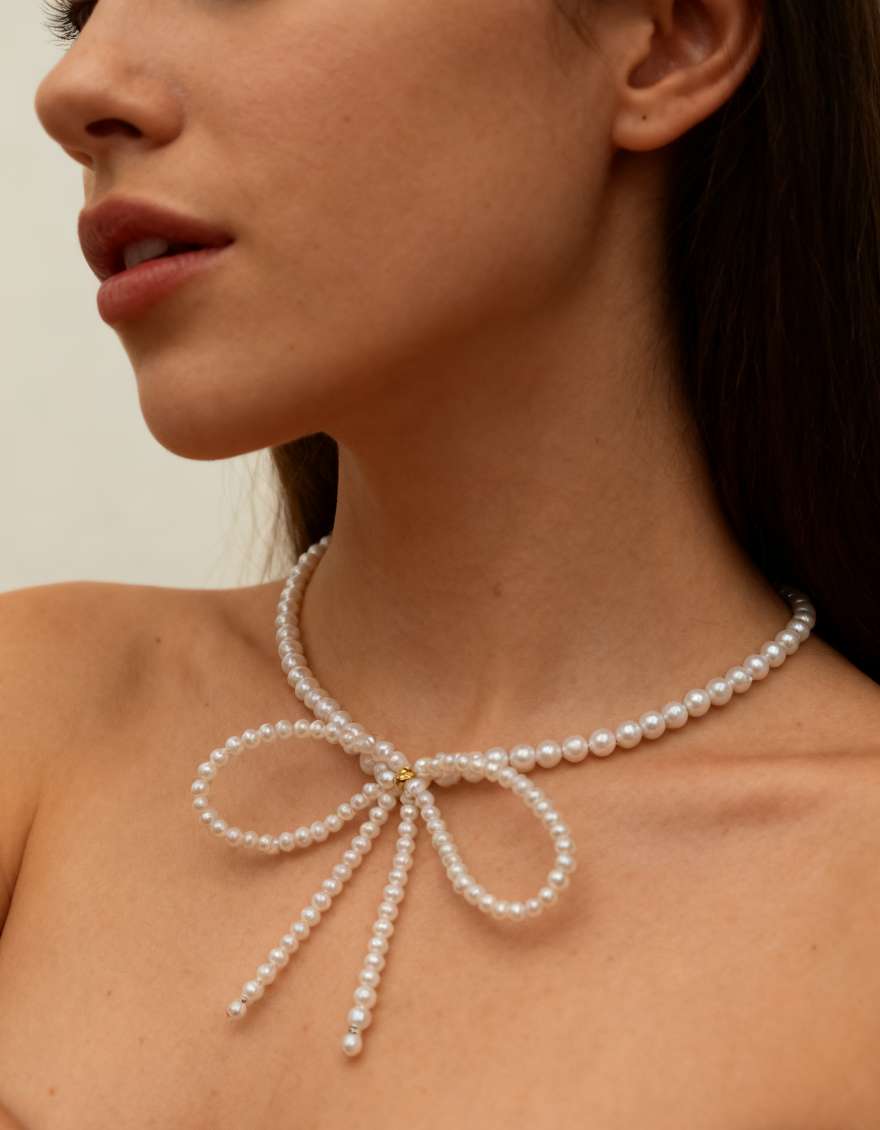 Natural pearl bow necklace: Fashionable, simple, youthful and exquisite pearl necklace details Picture