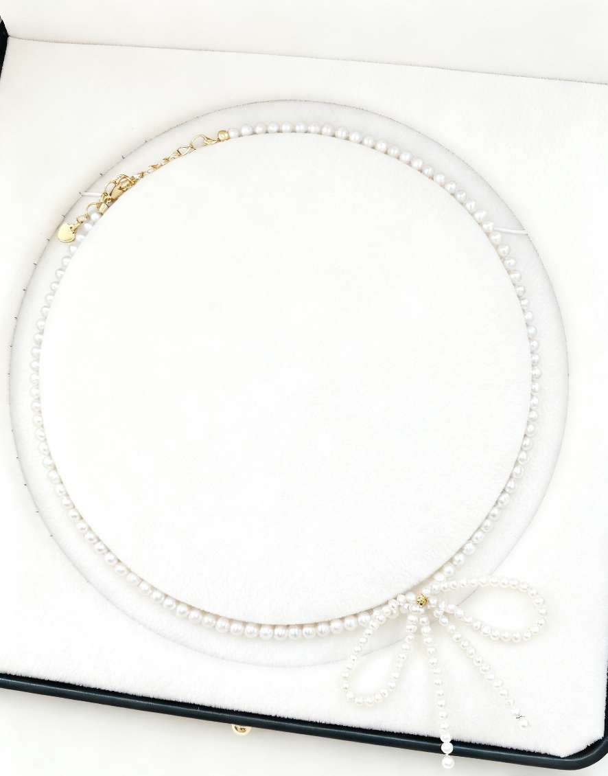 Natural pearl bow necklace: Fashionable, simple, youthful and exquisite pearl necklace Item Picture
