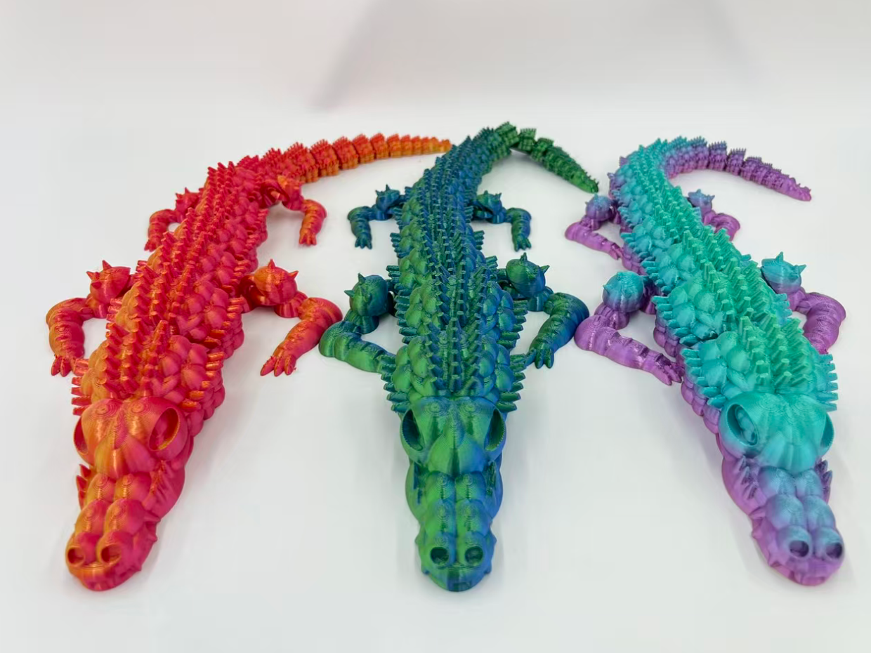 40cm3D печатает мультисуставы, которые могут двигать фигурки аллигаторов