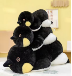 A plush penguin figurine pic 1
