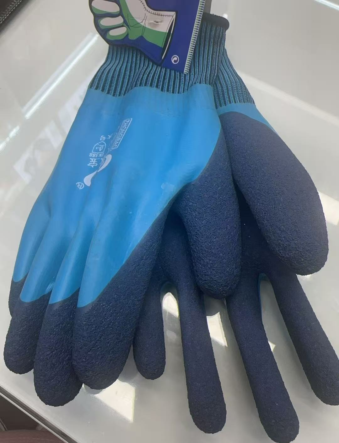 Wholesale labor protection gloves, wear-resistant and waterproof dipped plastic gloves, blue and orange details Picture