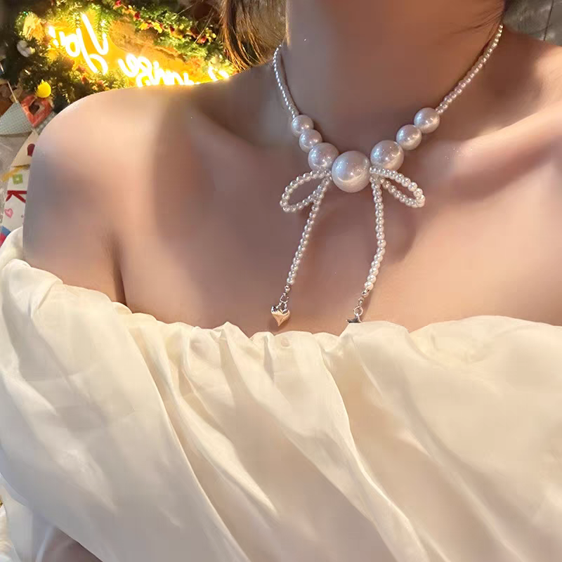 诗洛琪饰品新款时尚气质大小仿珍珠项链女超仙串珠蝴蝶结流苏颈链设计锁骨链