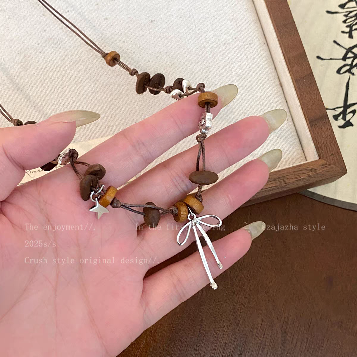 诗洛琪饰品蝴蝶结咖啡豆编织项链女小众高级感毛衣链新款抽拉可调节配饰详情图3