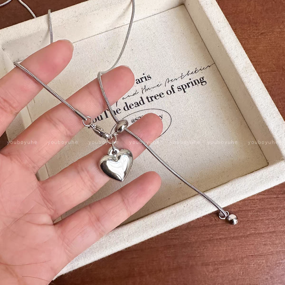 Siloqi jewelry: Simple silver heart-shaped pendant necklace for women, light luxury and high-end feel. Long sweater chain for autumn and winter, adjustable and pull-out accessory detail image 4