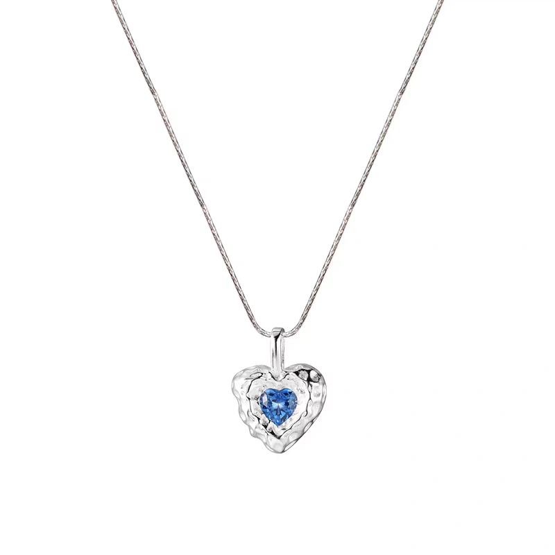 The S925 pure silver blue heart-shaped necklace exudes a high-end feminine charm. It features a sweet and cool, niche design. The collarbone chain is a unique and cold style accessory Application Scenario