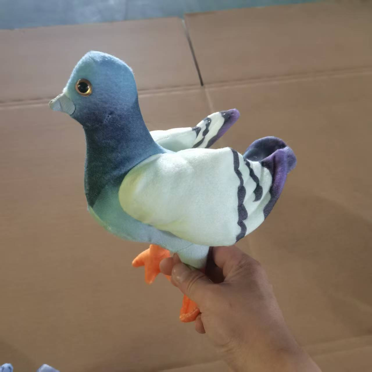 Blue and grey plush toy of the Nebo Magpie