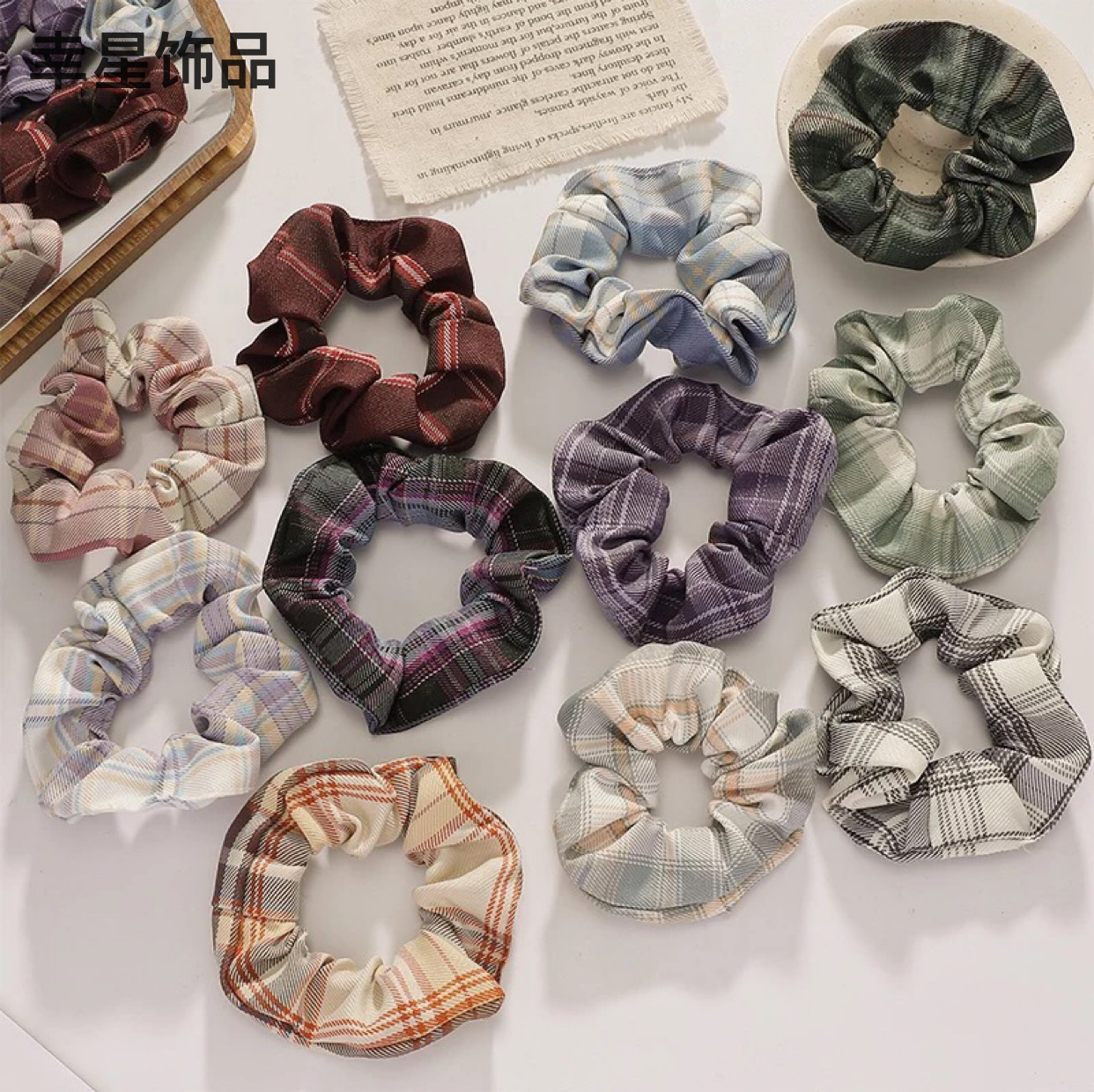 The new checkered trendy headwear features a woolen hair band that is retro and simple, a versatile fabric hair tie for girls, and a fat intestine hair tie