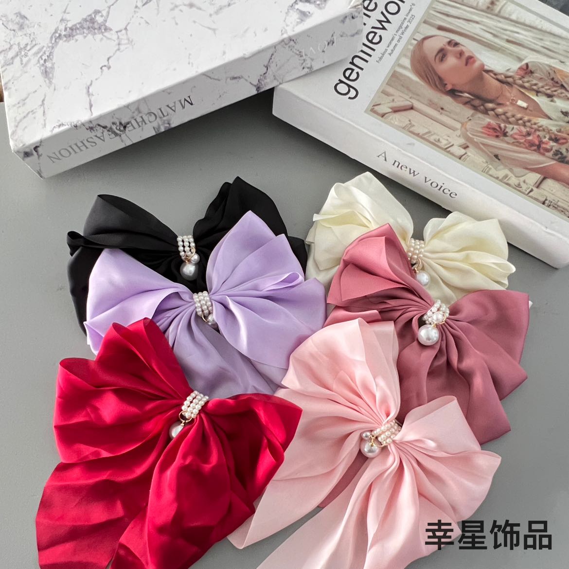 Xingxing Accessories French large bow hair clip, a trendy and fashionable style, with a spring clip on the top of the back of the head details Picture