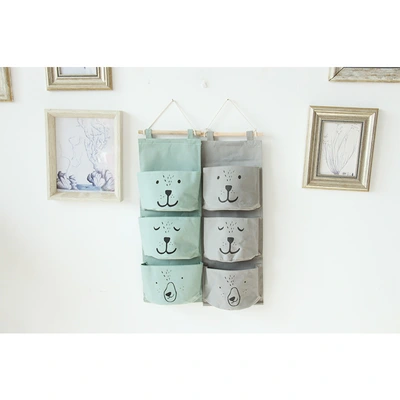 Yiwu good millet wheat expression cartoon cloth art three pockets semicircular receive hanging bag canvas modeling wall hanging type thumbnail