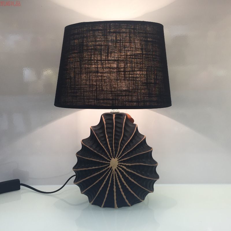 Kaiwei ceramic lamp styled in a cozy bedroom with linen bedding and wood furniture
